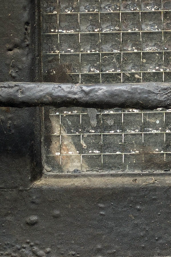 Photo 25339: Little, black, barred cellar window