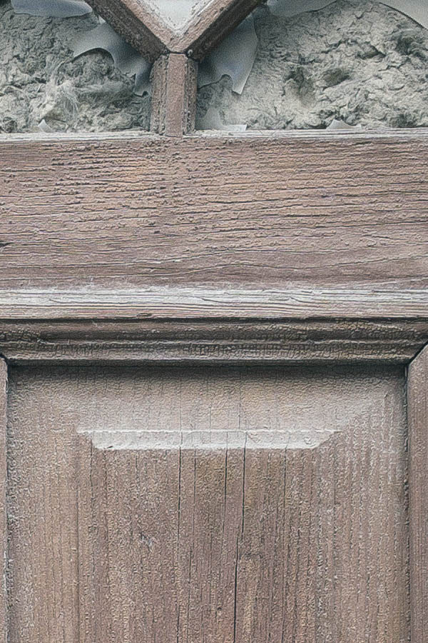 Photo 25403: No door. A former, decayed, brown, panelled door in a decayed wall