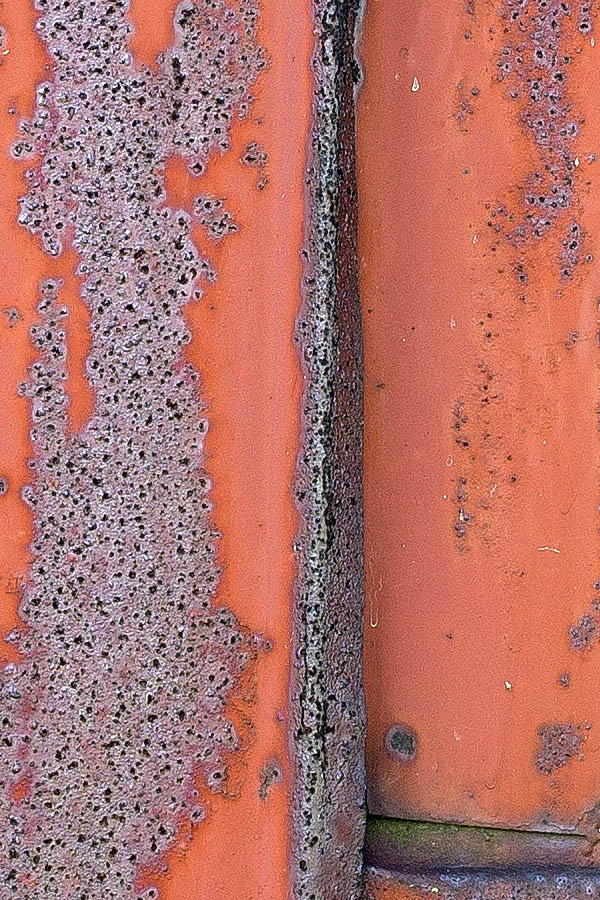 Photo 25448: No window: Facade with red and rusty metal plates and a window hole