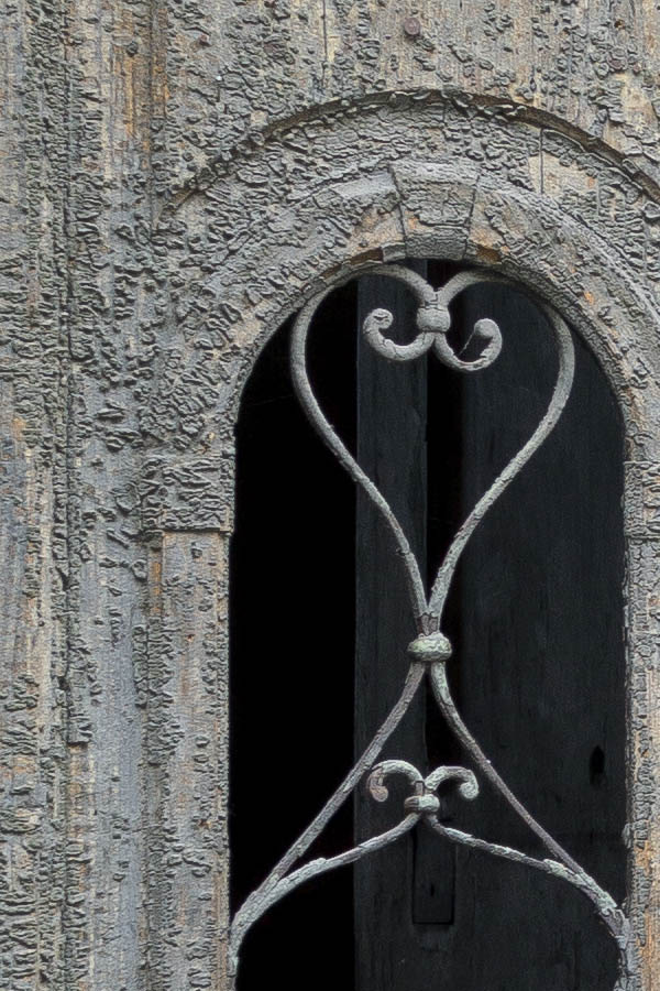 Photo 25538: Worn, panelled, grey and unpainted gate with formed, latticed door lights and top window