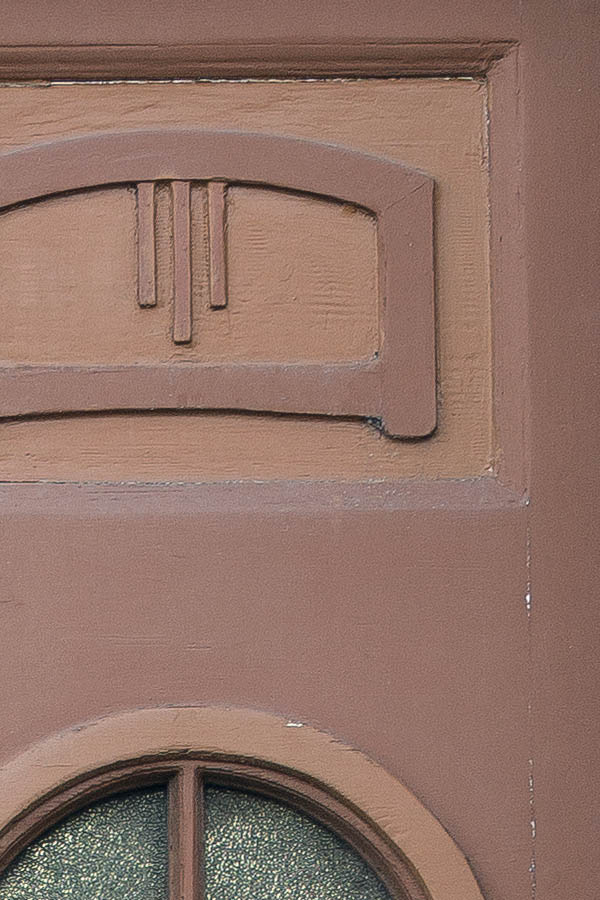 Photo 25597: Narrow, panelled, carved, orange and brown double door with formed door lights