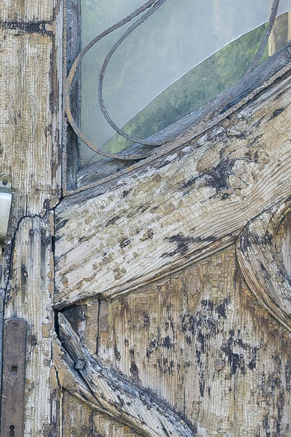 Photo 25690: Decayed, panelled, yellow and unpainted double door with latticed door light and top window