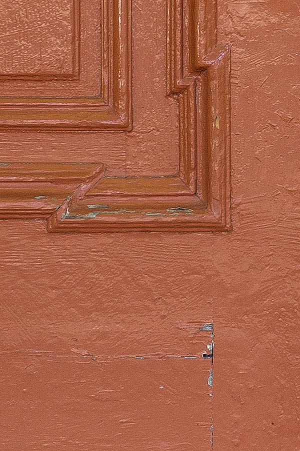 Photo 25692: Panelled, carved, orange and yellow gate with latticed top window