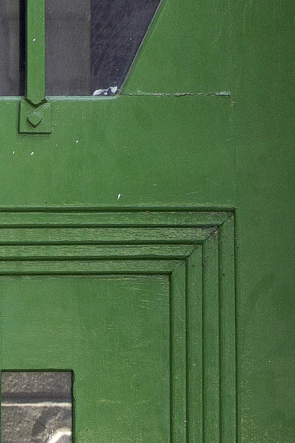Photo 25730: Panelled, carved, green double door with hexagonal, barred door lights and top window