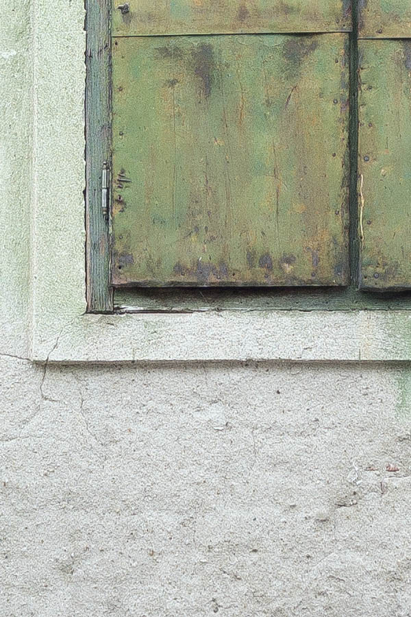 Photo 25757: Worn, light green facade with three blocked windows