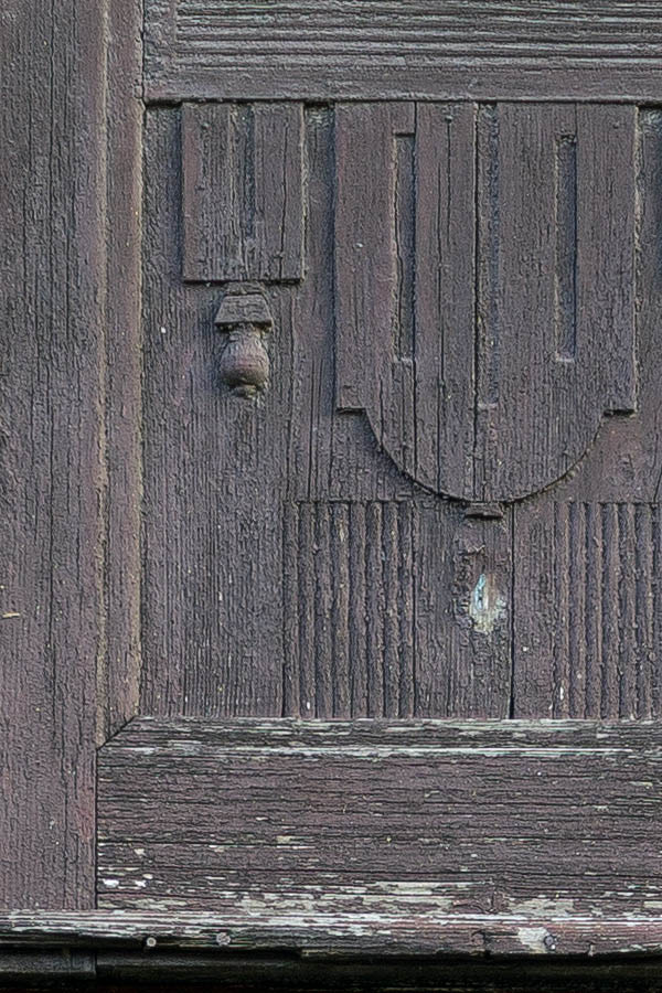 Photo 25838: Worn, panelled, carved, formed, brown gate with minor door and top windows