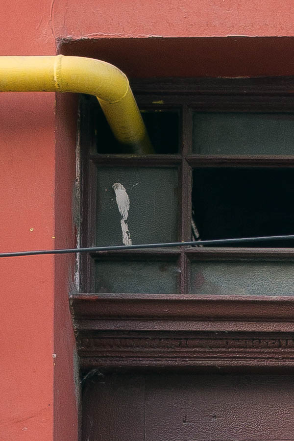 Photo 25840: Facade with narrow, panelled, carved, brown double door