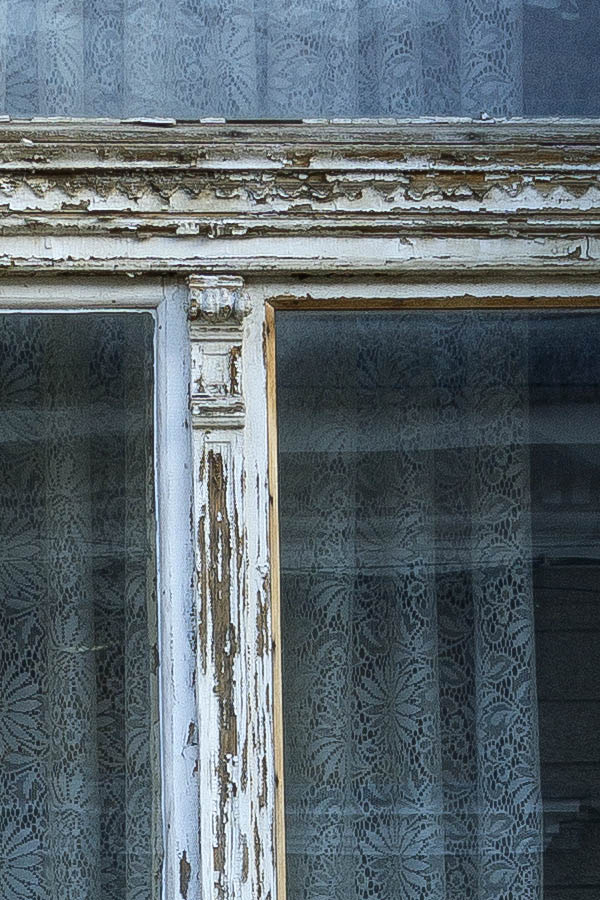 Photo 25844: Worn, carved, green window with three panes