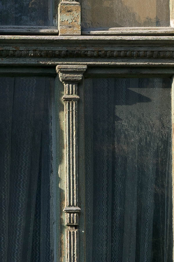 Photo 25863: Two green, carved windows with four frames each