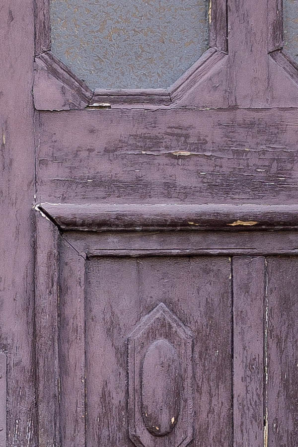 Photo 25935: Worn, panelled, lopsided, carved, purple double door with octogonal door lights and top window