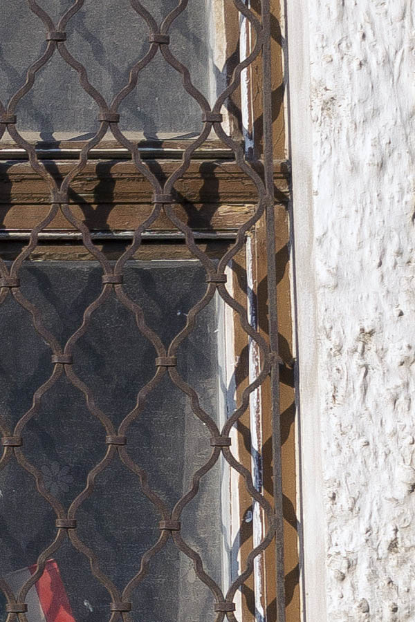 Photo 25946: Two worn, brown, latticed windows