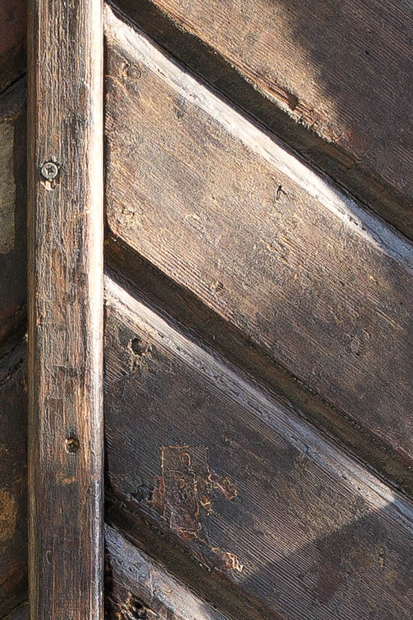 Photo 25968: Worn, formed, brown double door of diagonal boards