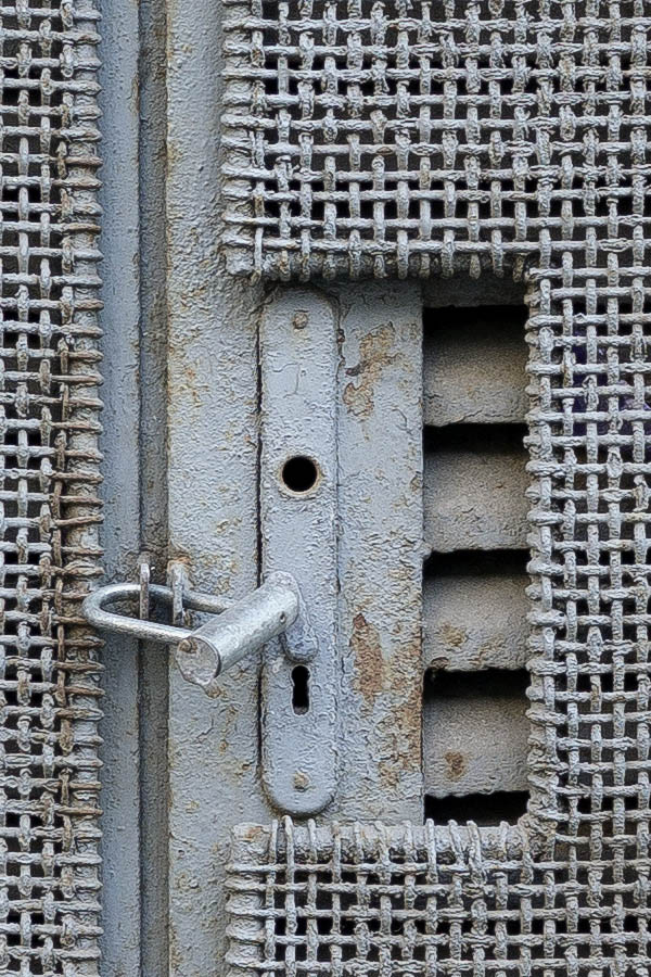 Photo 26036: Formed, latticed, grey metal double door