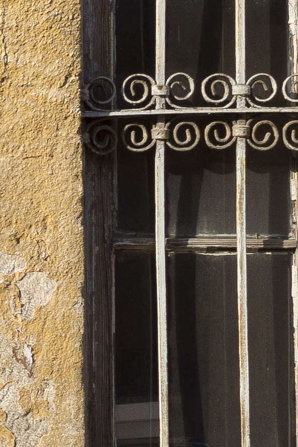 Photo 26369: Facade with grey, formed double door and two latticed windows