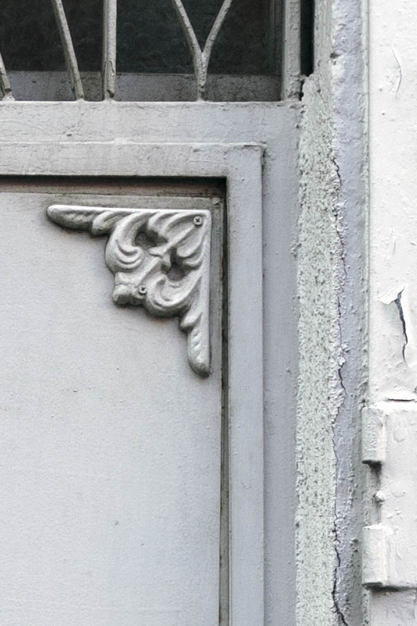 Photo 26463: Light grey metal door with top window and lattice