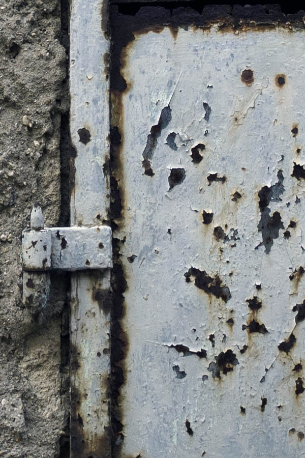 Photo 26480: Decayed, white metal shutters