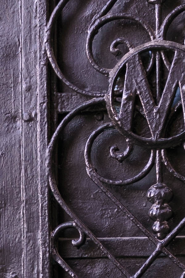 Photo 26598: Worn, black double door with lattice