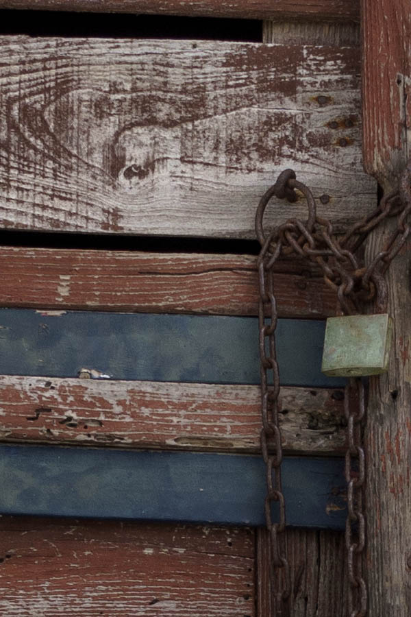 Photo 26713: Decayed and red, unpainted, panelled double door