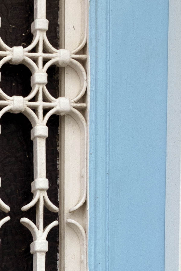Photo 26760: Narrow, light blue double door with latticed, white windows
