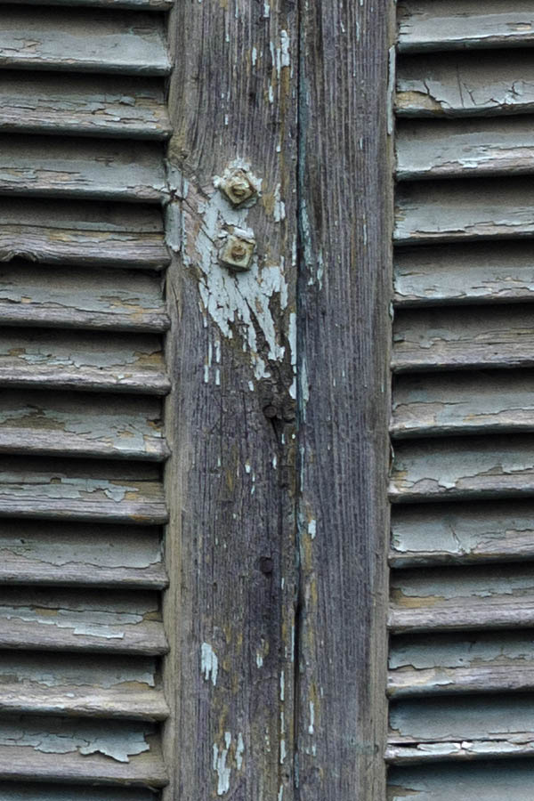 Photo 26919: Decayed, unpainted and teal shutters