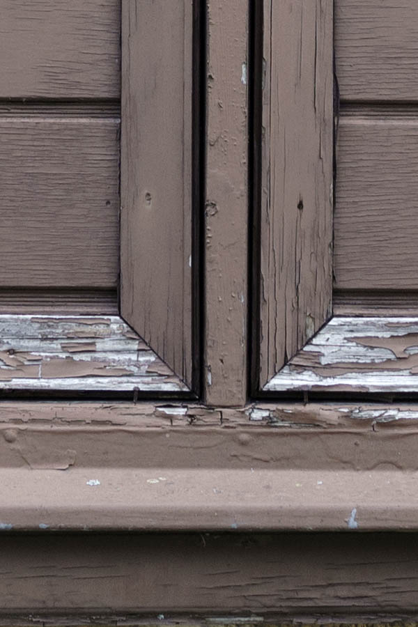 Photo 27103: Worn, brown window with double shutters