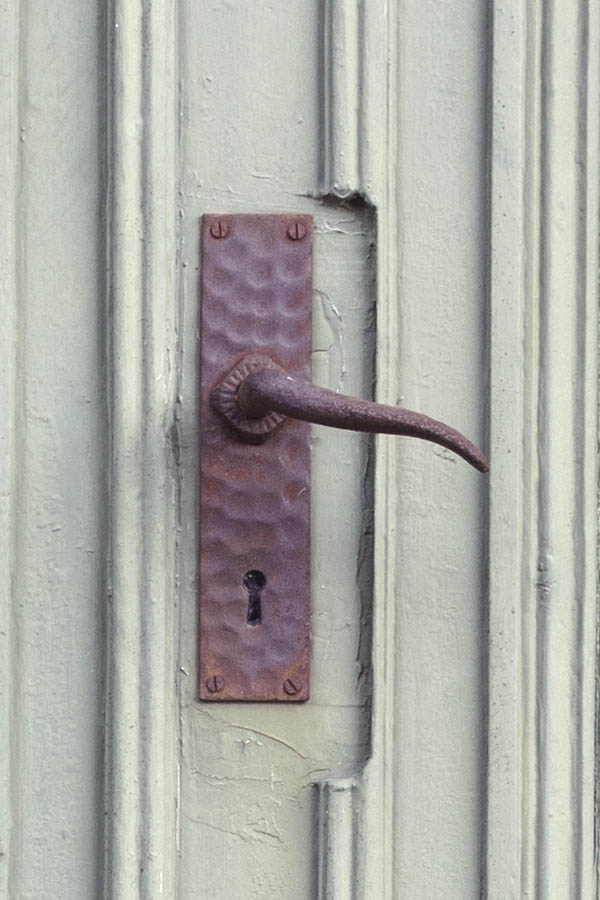Photo 27119: Worn, panelled, light green double door with banisters