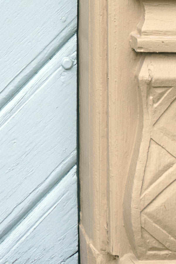 Photo 27207: Light blue double door of boards in diamond shape with light yellow, carved pilastre