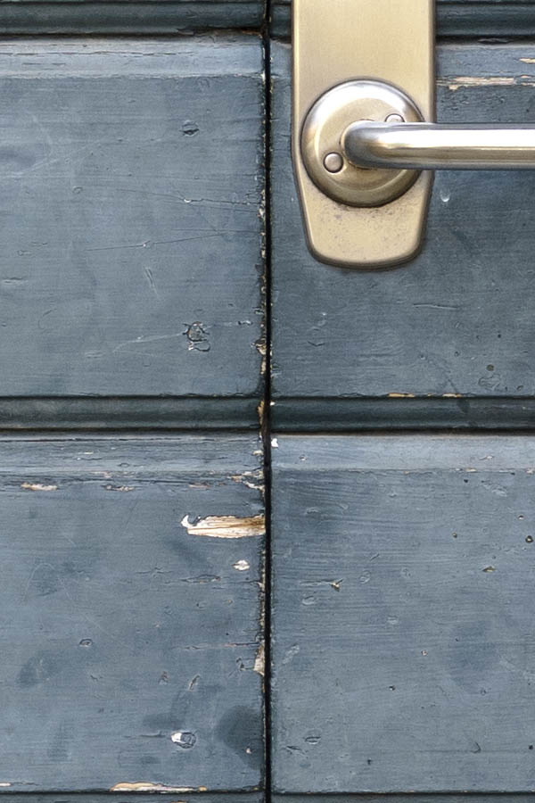 Photo 27275: Formed, teal double door of boards with oval door lights