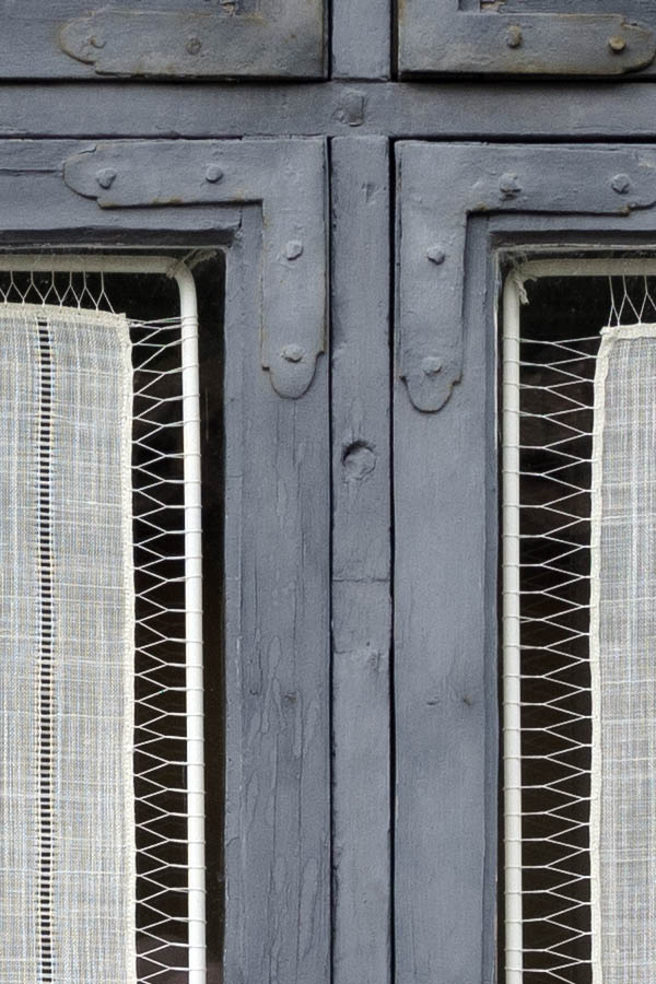 Photo 27291: Teal window with two frames, six panes and shutters of diagonal boards