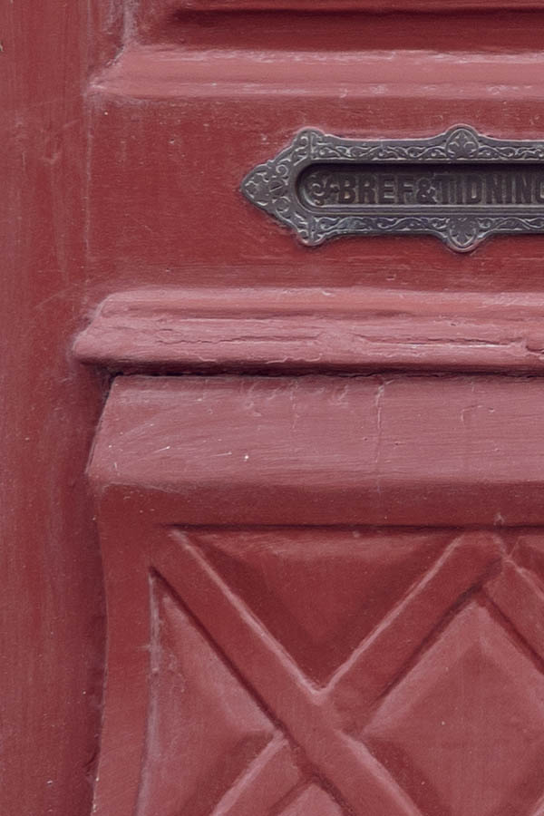 Photo 27296: Carved, panelled, red double door with oval door lights in a white frame