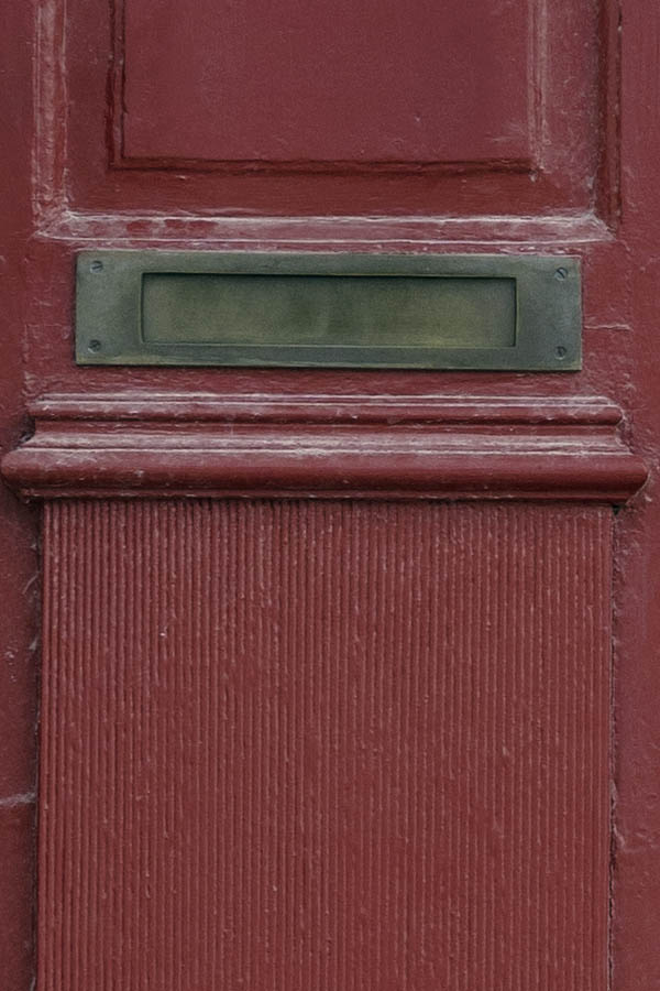Photo 27328: Carved, panelled, red double door in a carved pilastre