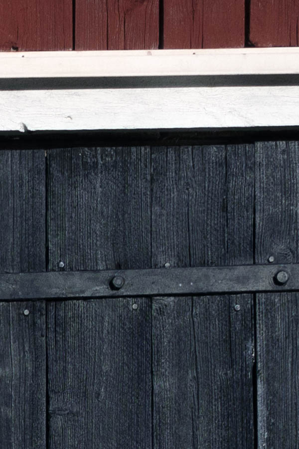 Photo 27354: Black gate of boards in a white frame
