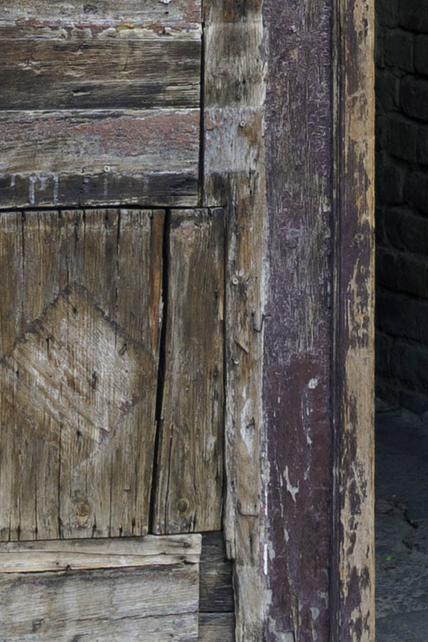 Photo 27381: Decayed, carved, purple gate with fan light with plastered pilastre