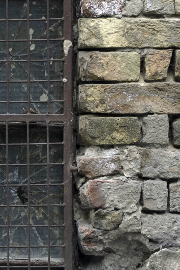 Photo 27384: Worn, brown, rusty, latticed window