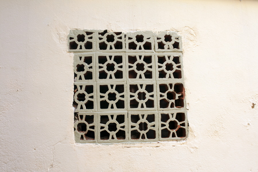 Photo 03016: Plastered, light red wall with opening blocked by grey bricks