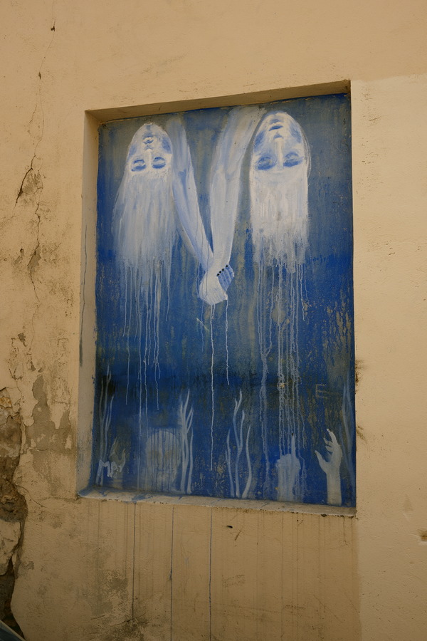 Photo 13146: Yellow, plastered wall with upside-down painting