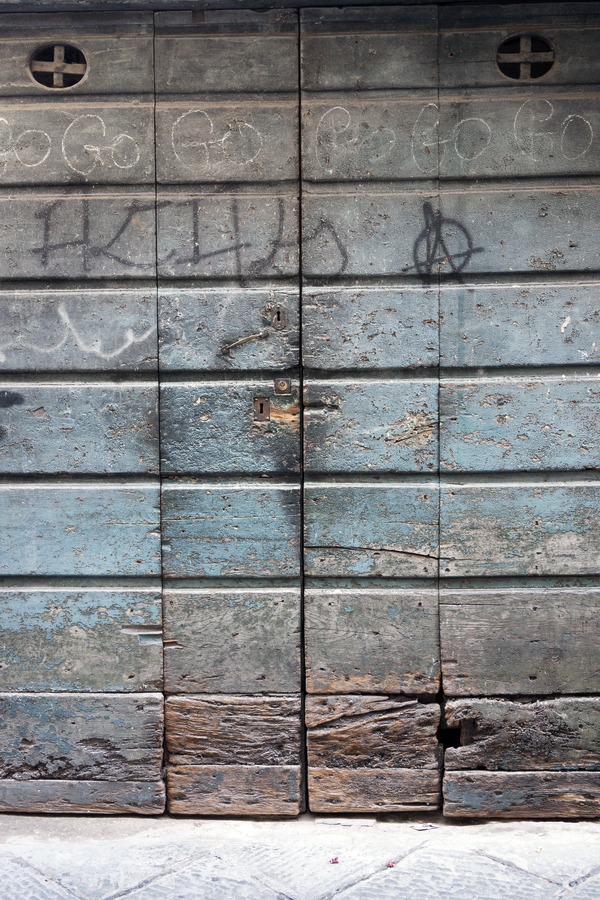 Photo 14895: Worn, brown and blue door of planks