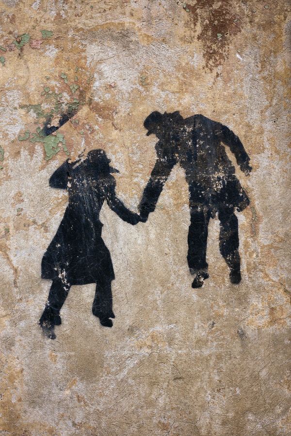 Photo 19228: Plastered, brown wall with black grafitti