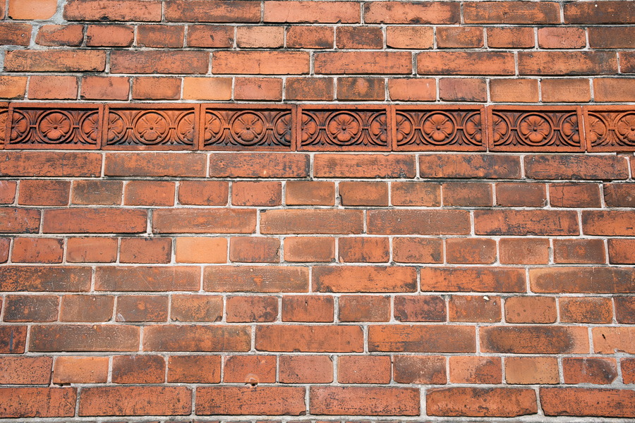Photo 25094: Red brick wall with a red frieze