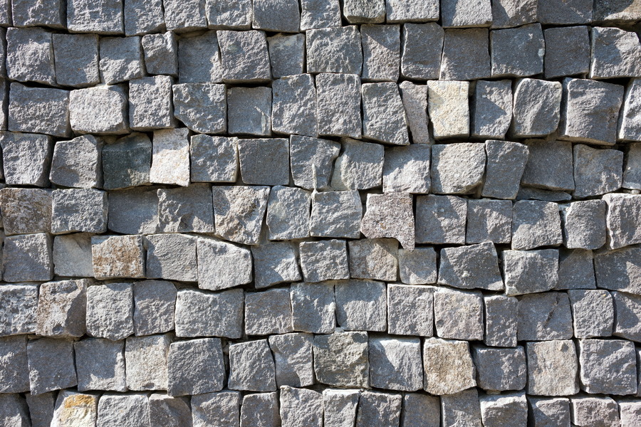Photo 25980: Irregular wall of square, grey granite stones