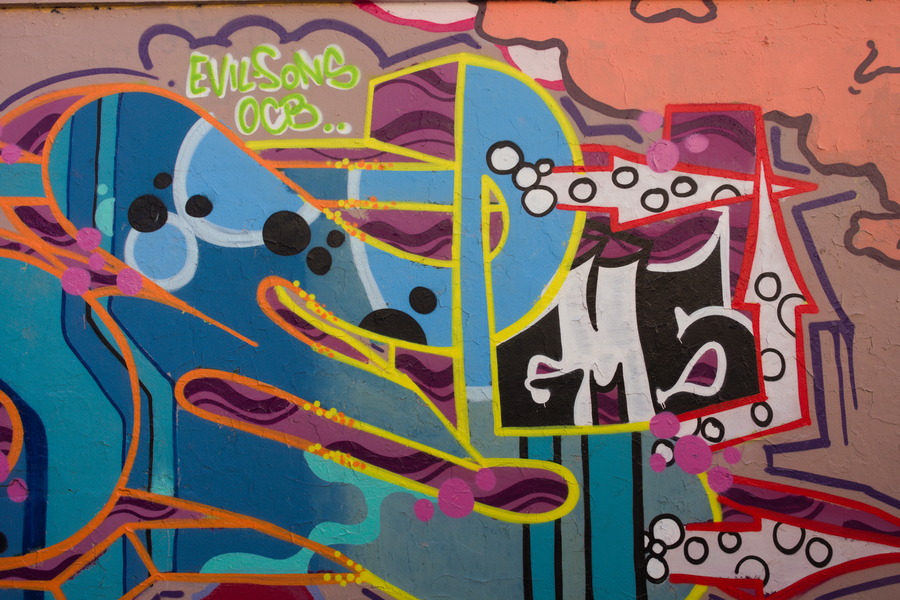 Photo 27486: Plastered wall with grafitti in blue, yellow, red, orange and green