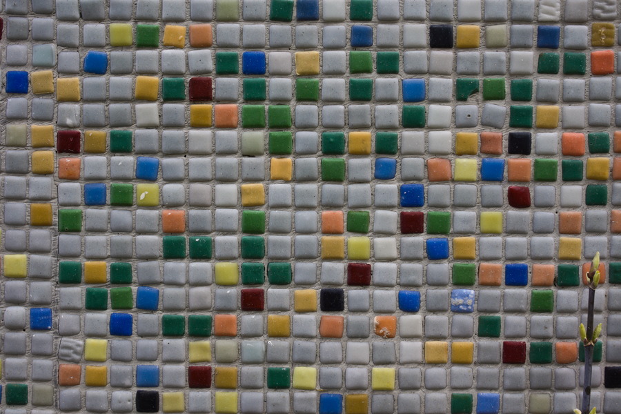Photo 27503: Mosaic wall of small, grey, green, blue and yellow tiles