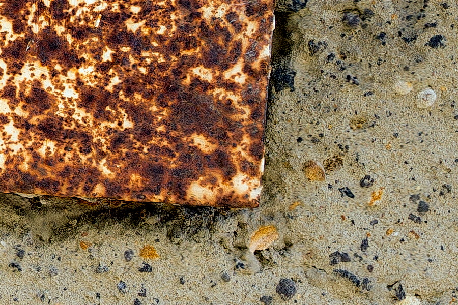 Photo 24684: Wall with grey and black plaster and a rusty hatch