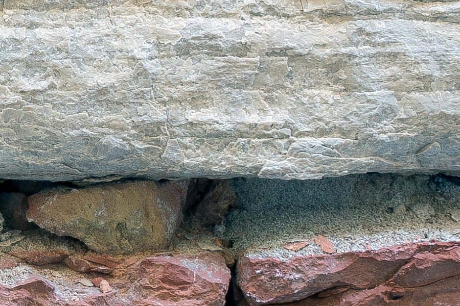 Photo 24867: Decayed brick wall in red, yellow and brown with white sandstone