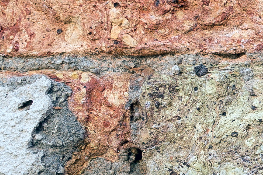 Photo 24876: Worn brick wall in yellow, red and grey colours