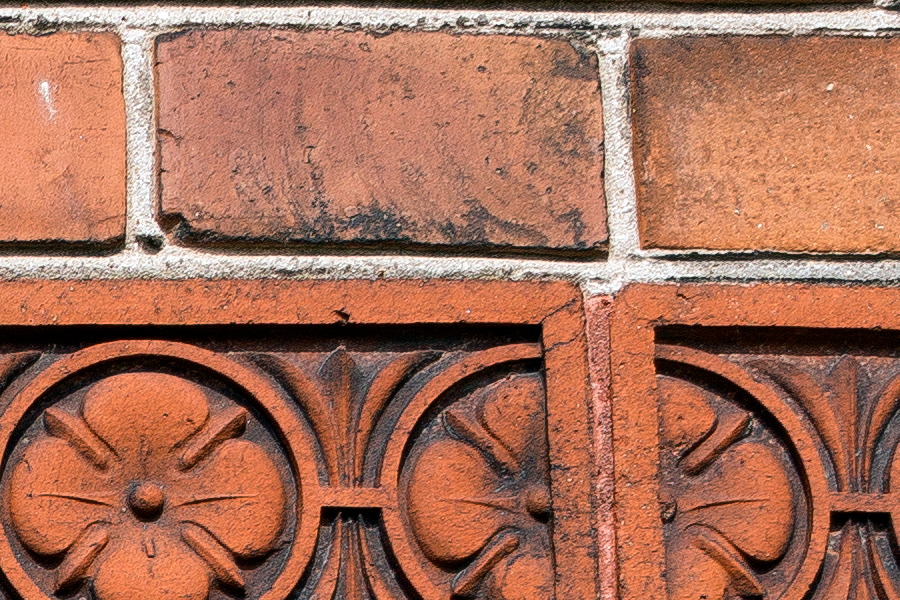 Photo 25094: Red brick wall with a red frieze