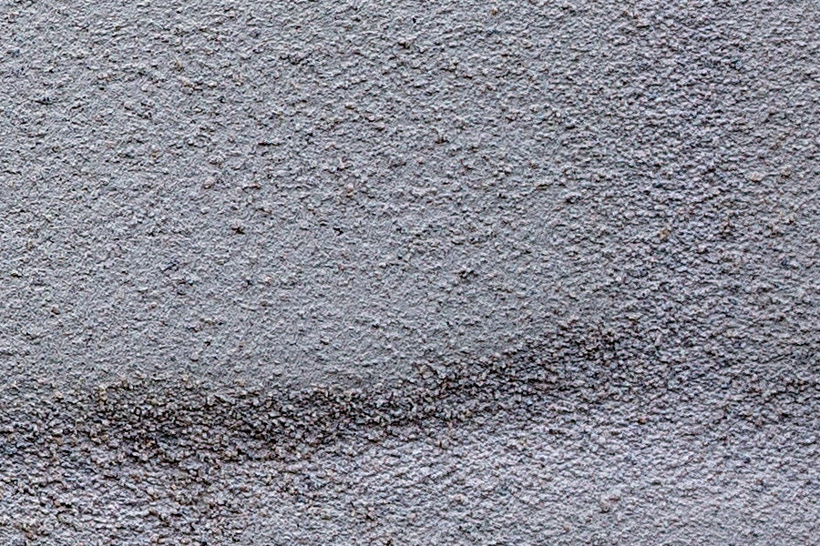 Photo 25246: Grey, plastered brick wall. Well maintained.