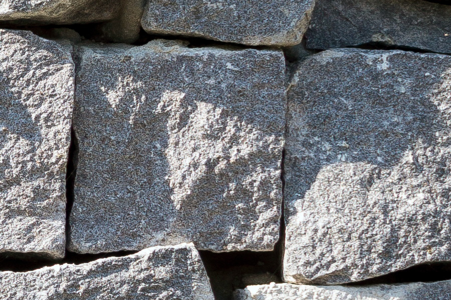 Photo 25980: Irregular wall of square, grey granite stones