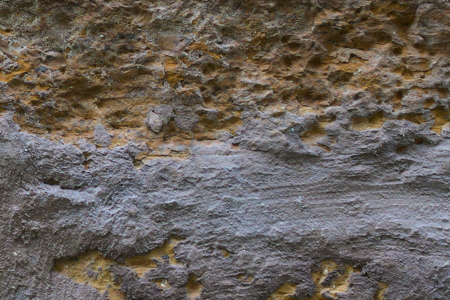 Photo 27438: Worn, yellow brick wall