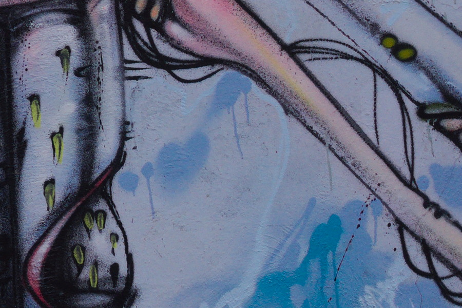 Photo 27466: Plastered, light blue wall with large grafitti
